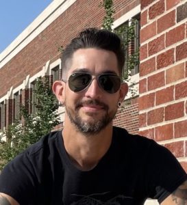 Mike in black tshirt and sunglasses