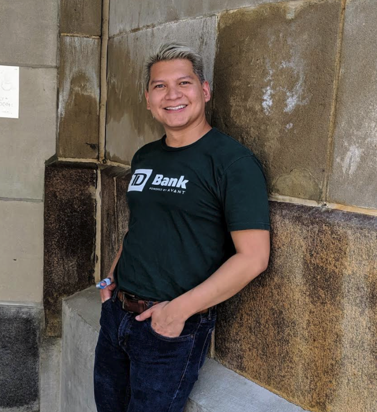 Smiling David with his hands in his pockets