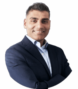 Nikhil smiling in a blue suit