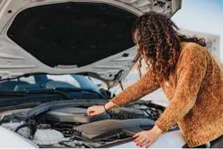 Person fixing a car